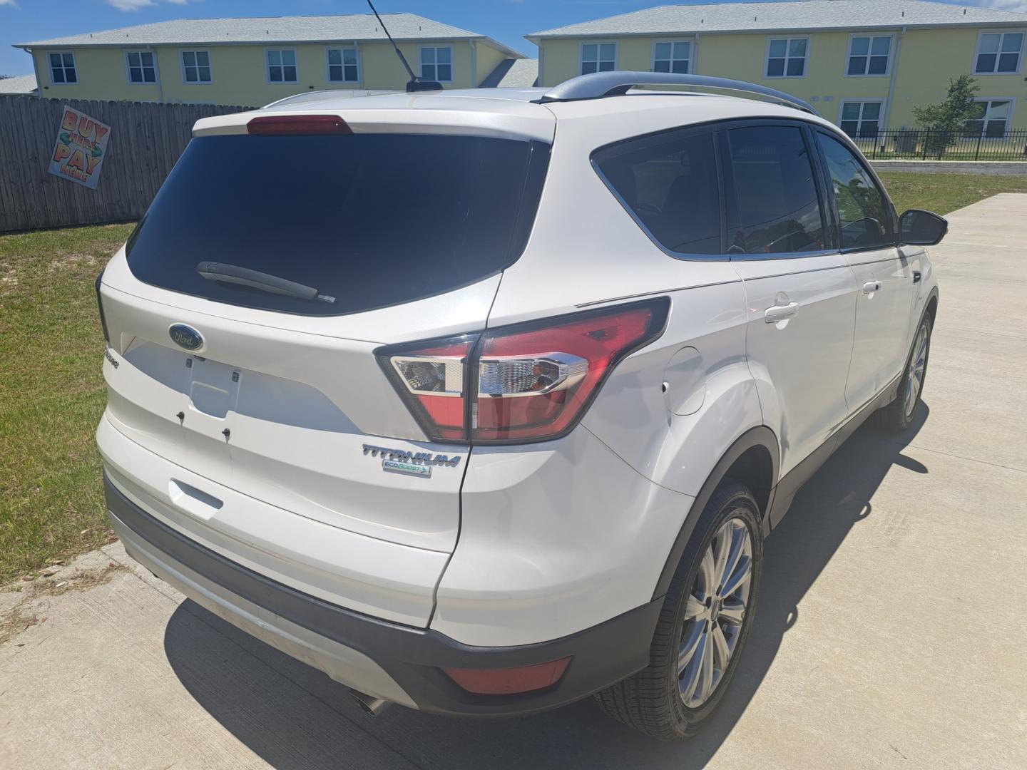 2017 White Ford Escape Titanium FWD (1FMCU0JD8HU) with an 1.5L L4 DOHC 16V engine, 6A transmission, located at 1181 Aurora Rd, Melbourne, FL, 32935, (321) 241-1100, 28.132914, -80.639175 - Photo#1